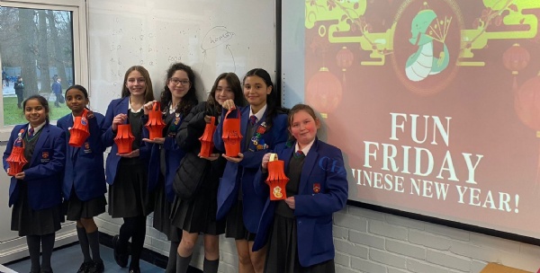 Students holding up the Chinese lanterns that they have made